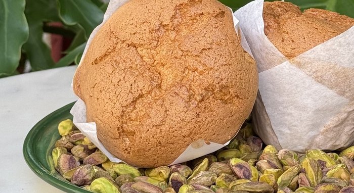 Pistachio spongie cakes on a bed of shelled pistachios